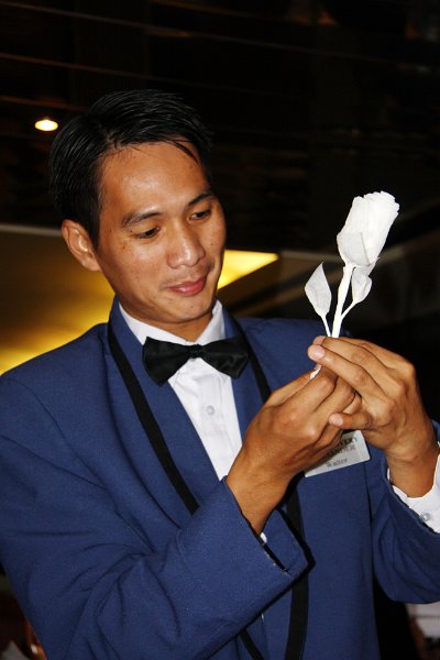 IMG_14100-e.jpg - Alexander making a rose from a paper napkin